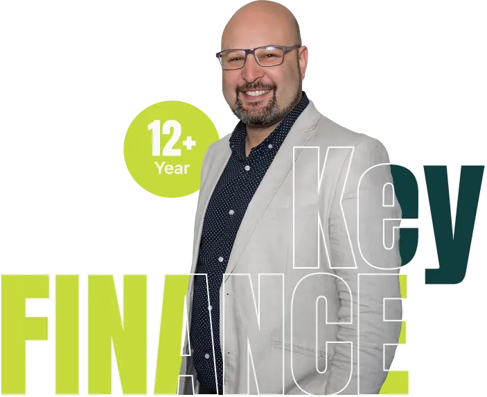 Smiling Key Finance broker beside a 12 plus years badge and the Key Finance name